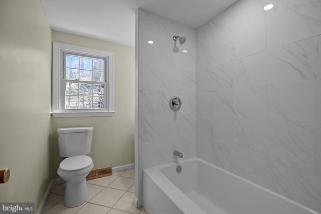 full bathroom featuring bathtub / shower combination, toilet, visible vents, baseboards, and tile patterned floors