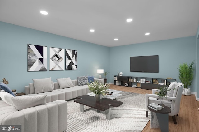 living room featuring baseboards, wood finished floors, and recessed lighting