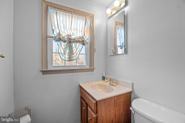 bathroom with vanity and toilet