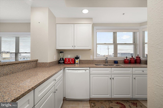 kitchen featuring light tile patterned floors, recessed lighting, white cabinetry, white dishwasher, and a sink