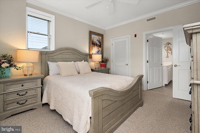 bedroom with light carpet, a ceiling fan, visible vents, a closet, and crown molding