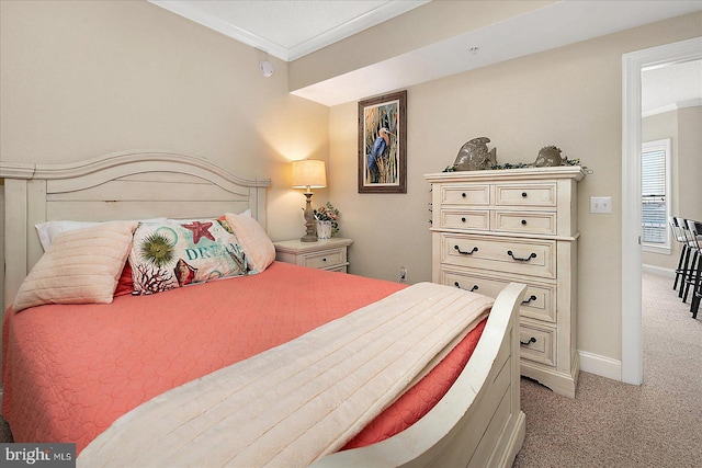 bedroom featuring light carpet, baseboards, and crown molding