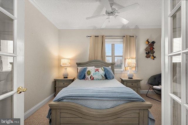 bedroom with a textured ceiling, carpet floors, ornamental molding, and baseboards