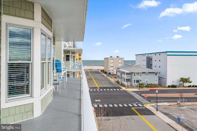 balcony featuring a water view