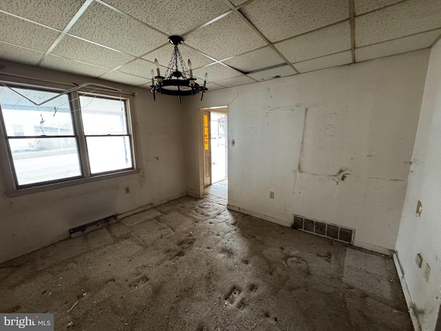 interior space featuring a drop ceiling and visible vents