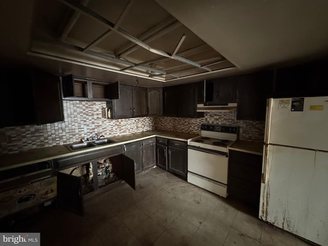 kitchen with tasteful backsplash, white appliances, a sink, and exhaust hood