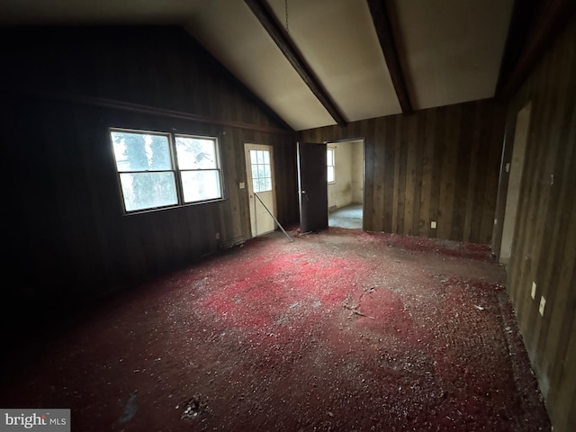 unfurnished room featuring lofted ceiling