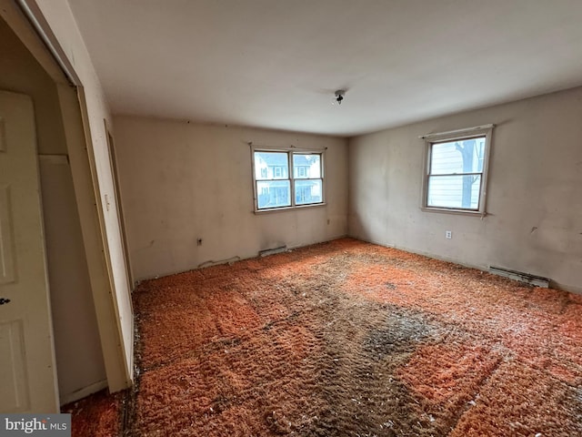 empty room with visible vents and plenty of natural light