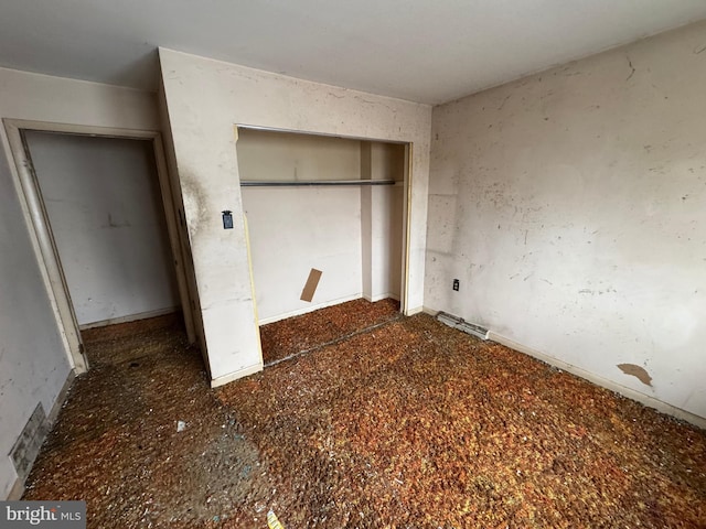 unfurnished bedroom featuring a closet