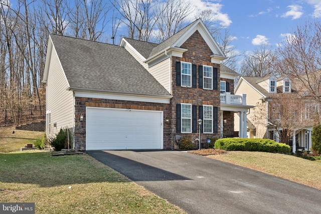 view of front of house with aphalt driveway, an attached garage, a front lawn, and roof with shingles