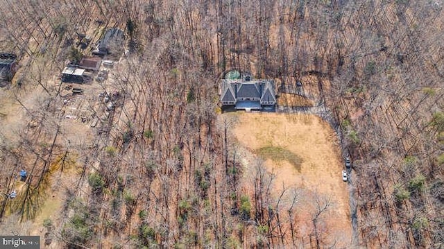 drone / aerial view with a view of trees