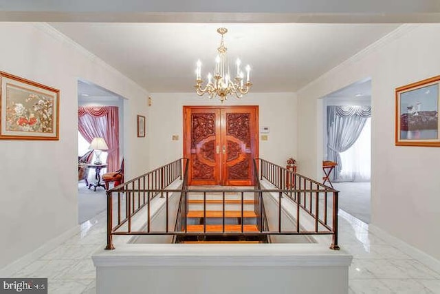 stairs featuring marble finish floor, baseboards, a notable chandelier, and ornamental molding