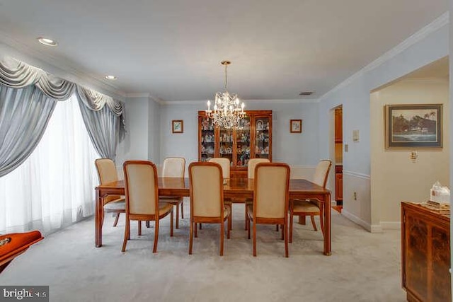 dining area with light carpet, baseboards, a notable chandelier, and crown molding