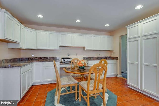 kitchen featuring recessed lighting, white cabinets, and light tile patterned floors