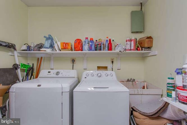 clothes washing area featuring laundry area and washing machine and clothes dryer