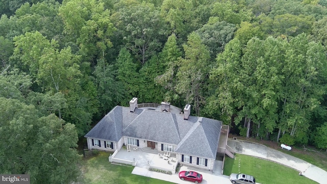 aerial view featuring a view of trees