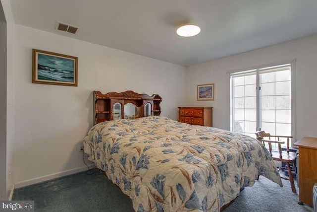 carpeted bedroom featuring visible vents and baseboards