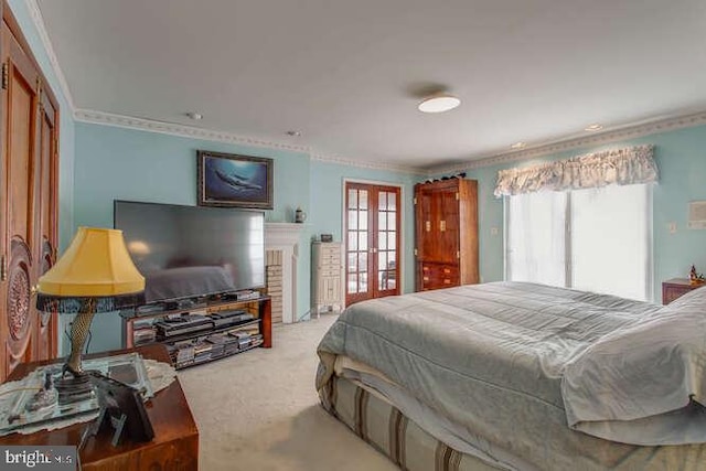 bedroom with french doors, carpet flooring, and crown molding