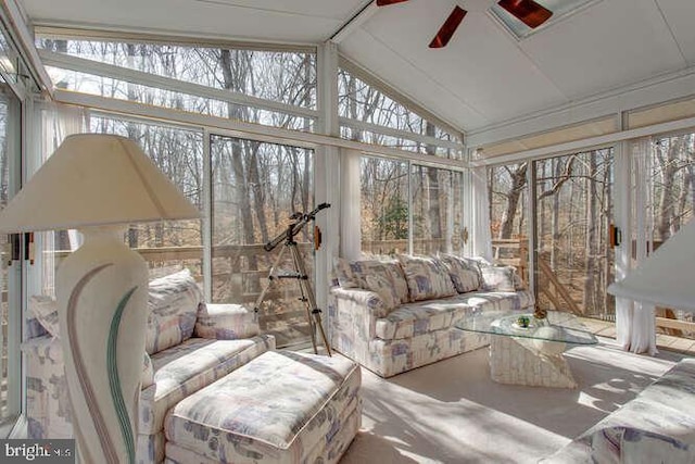 sunroom with lofted ceiling and ceiling fan