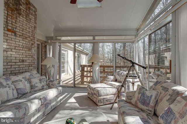 sunroom with a ceiling fan