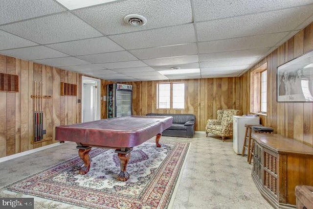 playroom with a paneled ceiling, wooden walls, billiards, visible vents, and baseboards