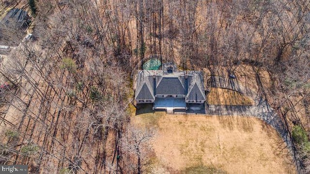 aerial view featuring a wooded view