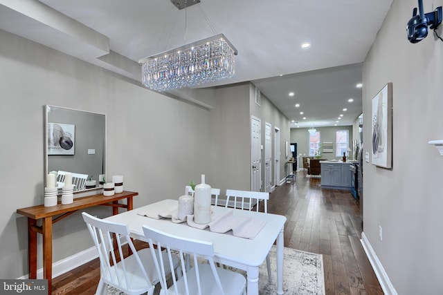 dining area with baseboards, dark wood-style flooring, and recessed lighting