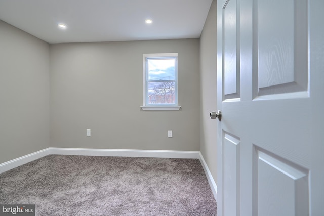 carpeted spare room with recessed lighting and baseboards