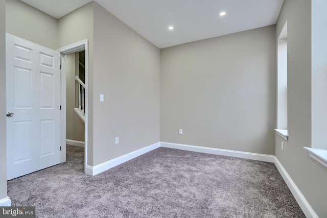 unfurnished room with recessed lighting, carpet flooring, and baseboards