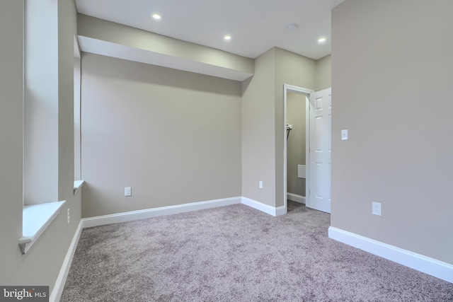 unfurnished room with carpet floors, recessed lighting, and baseboards