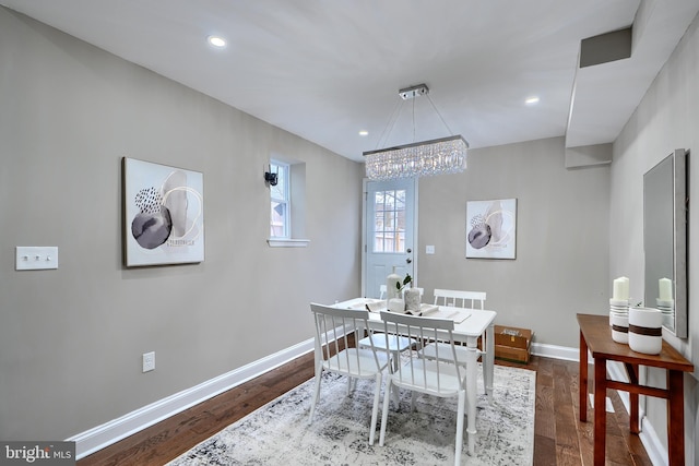 dining room with baseboards, dark wood-style flooring, and recessed lighting