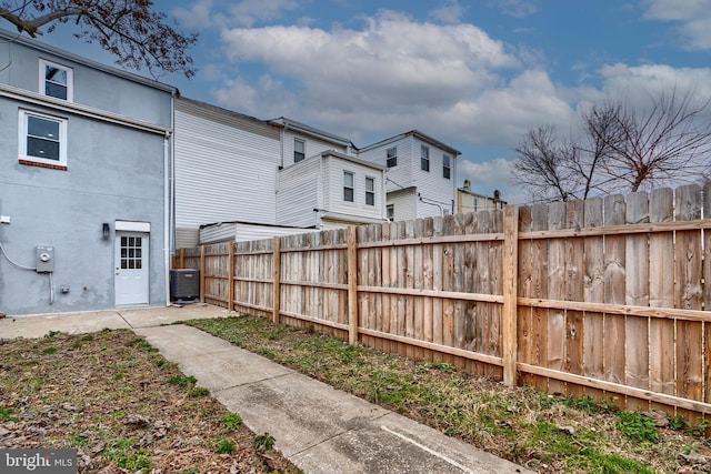 exterior space featuring cooling unit and fence