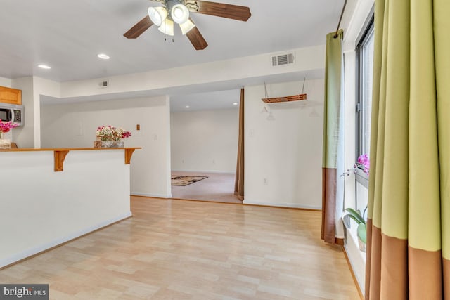 empty room featuring recessed lighting, baseboards, visible vents, and light wood finished floors