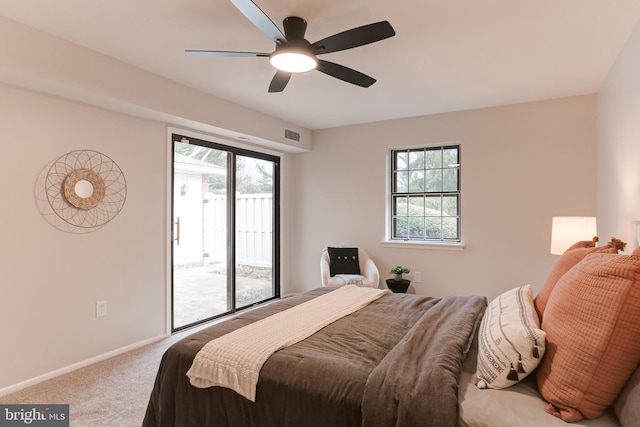 bedroom featuring access to exterior, carpet, visible vents, a ceiling fan, and baseboards