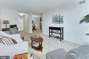 carpeted living area with visible vents