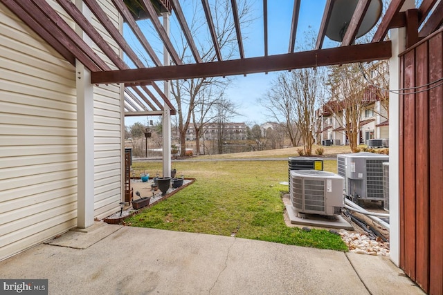 view of yard with a patio and central AC unit