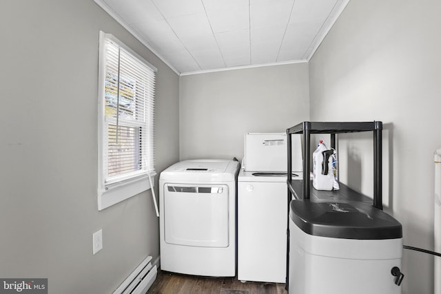 clothes washing area featuring laundry area, dark wood-style floors, crown molding, and washing machine and clothes dryer