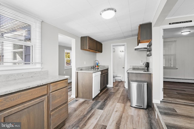 kitchen with dark wood-style flooring, crown molding, white dishwasher, range, and under cabinet range hood