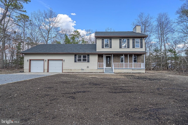 view of front of house with covered porch, a garage, brick siding, driveway, and a chimney