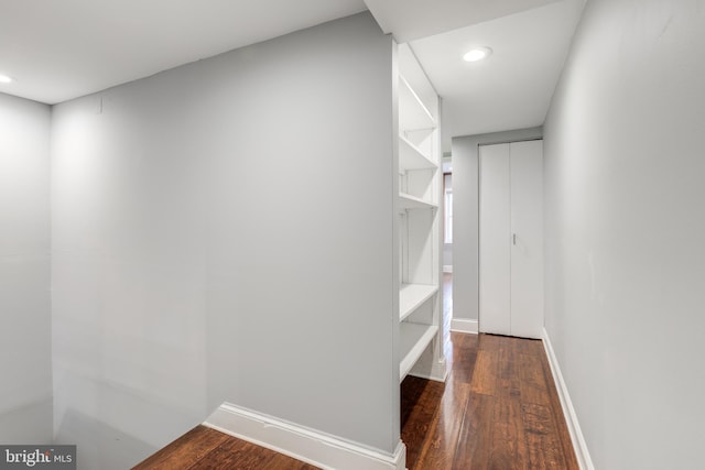 spacious closet with wood finished floors