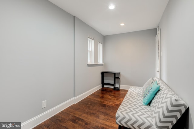 sitting room with recessed lighting, dark wood-style flooring, and baseboards