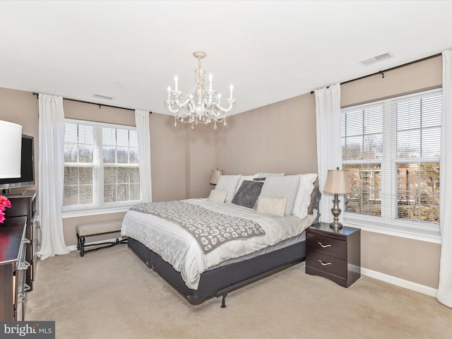 bedroom with visible vents, light colored carpet, and baseboards