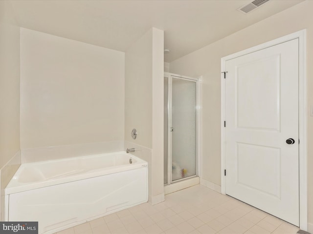 full bath featuring a garden tub, visible vents, a stall shower, and tile patterned floors