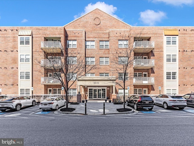 view of property with uncovered parking