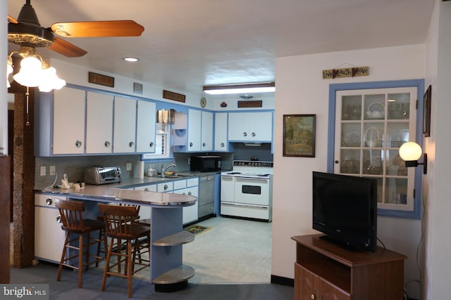 kitchen featuring backsplash, black microwave, stainless steel dishwasher, white electric range oven, and a sink