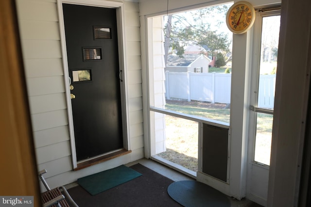 doorway to outside featuring a healthy amount of sunlight