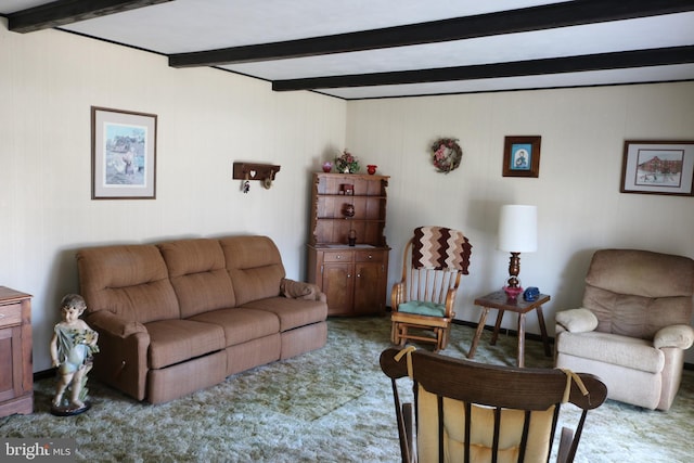 living area with beam ceiling and carpet floors