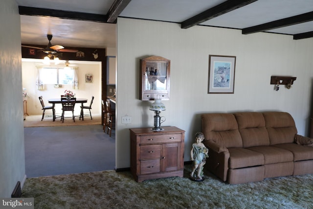 living room featuring carpet floors, beam ceiling, and ceiling fan