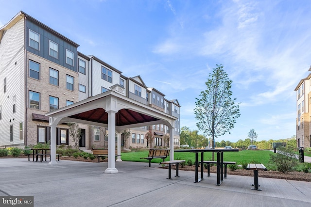 surrounding community with a yard and a gazebo