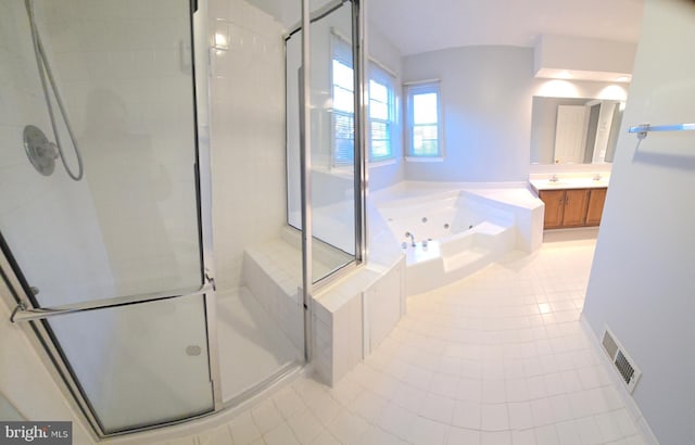 bathroom featuring visible vents, a stall shower, vanity, a tub with jets, and tile patterned floors